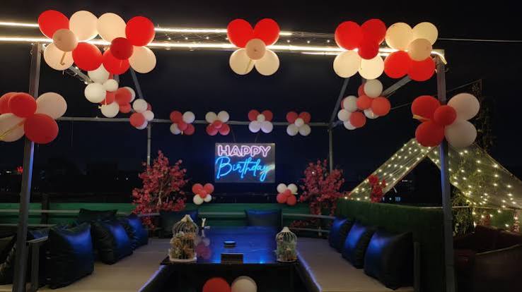 Birthday celebration cafe setup guide at Tent Rooftop Restro Cafe Navrangpura Ahmedabad